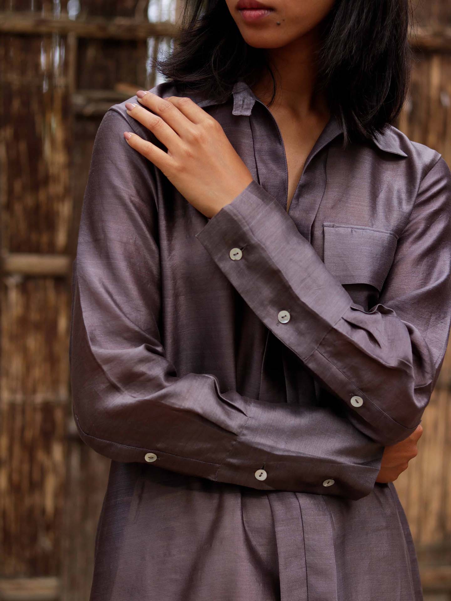 Long v neck slip-on grey-violet easy shirt with box pleat at back & asymmetrical hem, Relaxed Fit, Shell Buttons, Tea dyed Handwoven Chanderi Silk fabric.