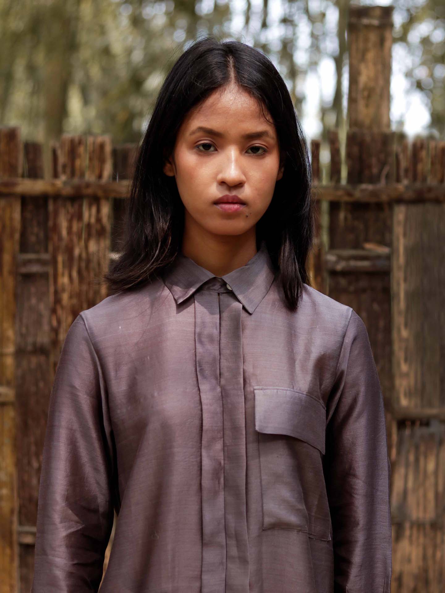 Long v neck slip-on grey-violet easy shirt with box pleat at back & asymmetrical hem, Relaxed Fit, Shell Buttons, Tea dyed Handwoven Chanderi Silk fabric.