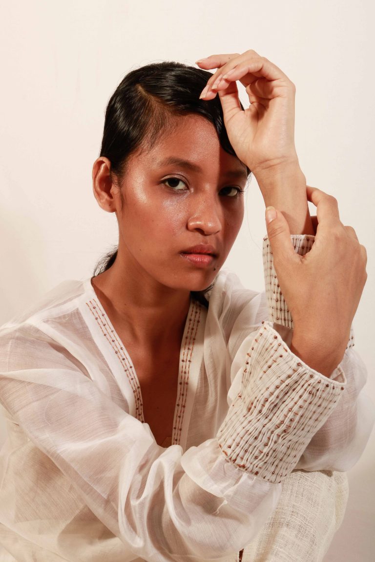 “V” Neck off-white translucent chanderi silk top with handcrafted embroidery and beadwork detail for women.