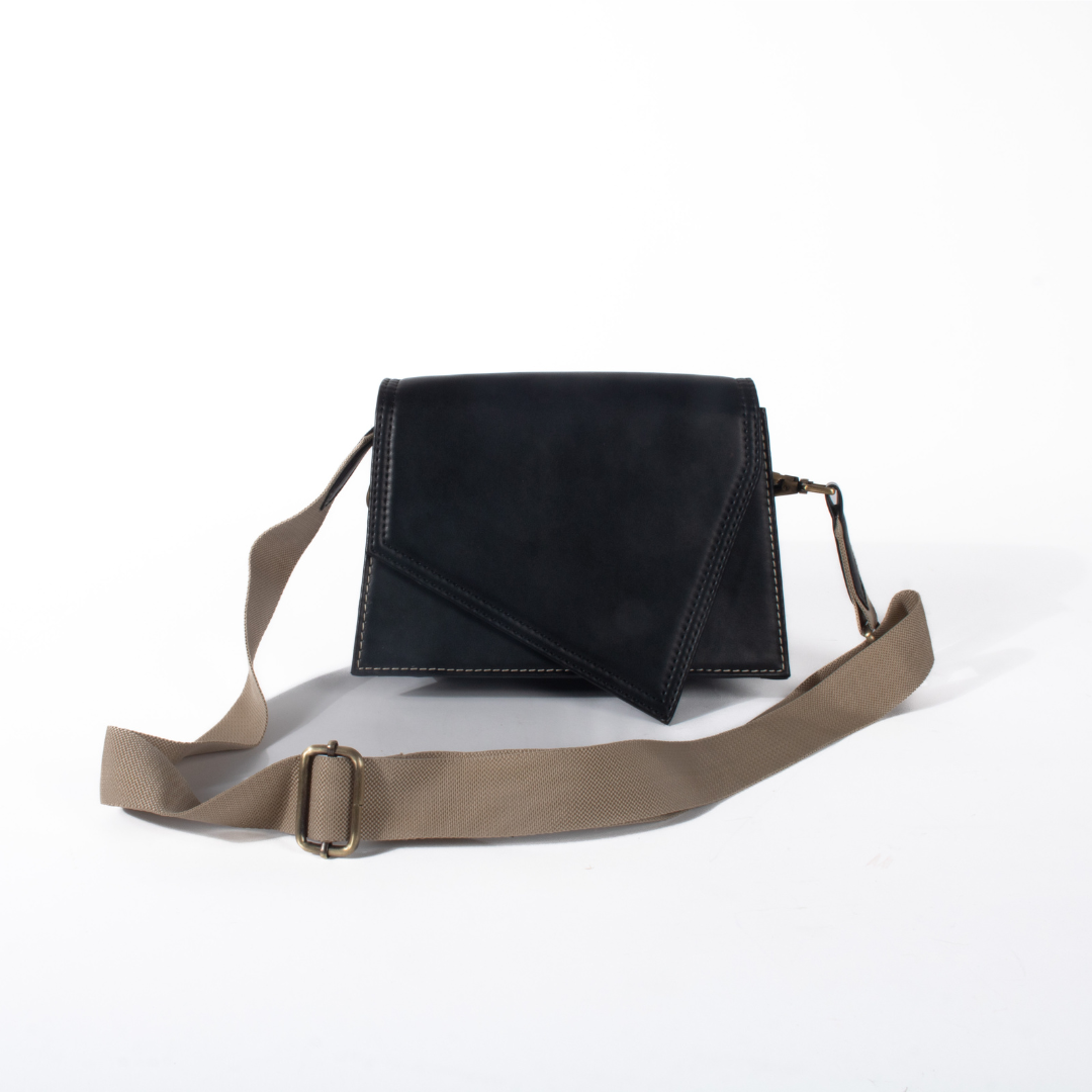 Black sling bag adjustable made with conscious and vegan leather.