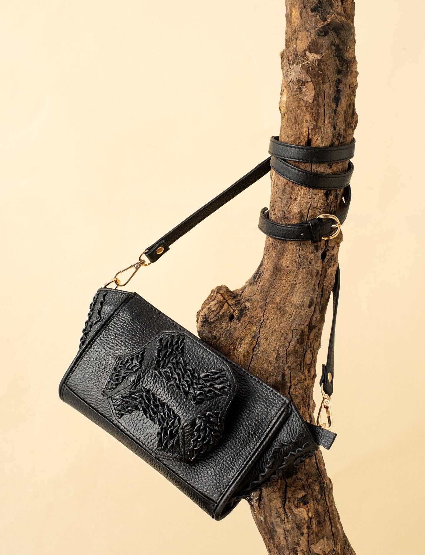 Black upcycled leather unisex wristlet, handcrafted and braided bag.