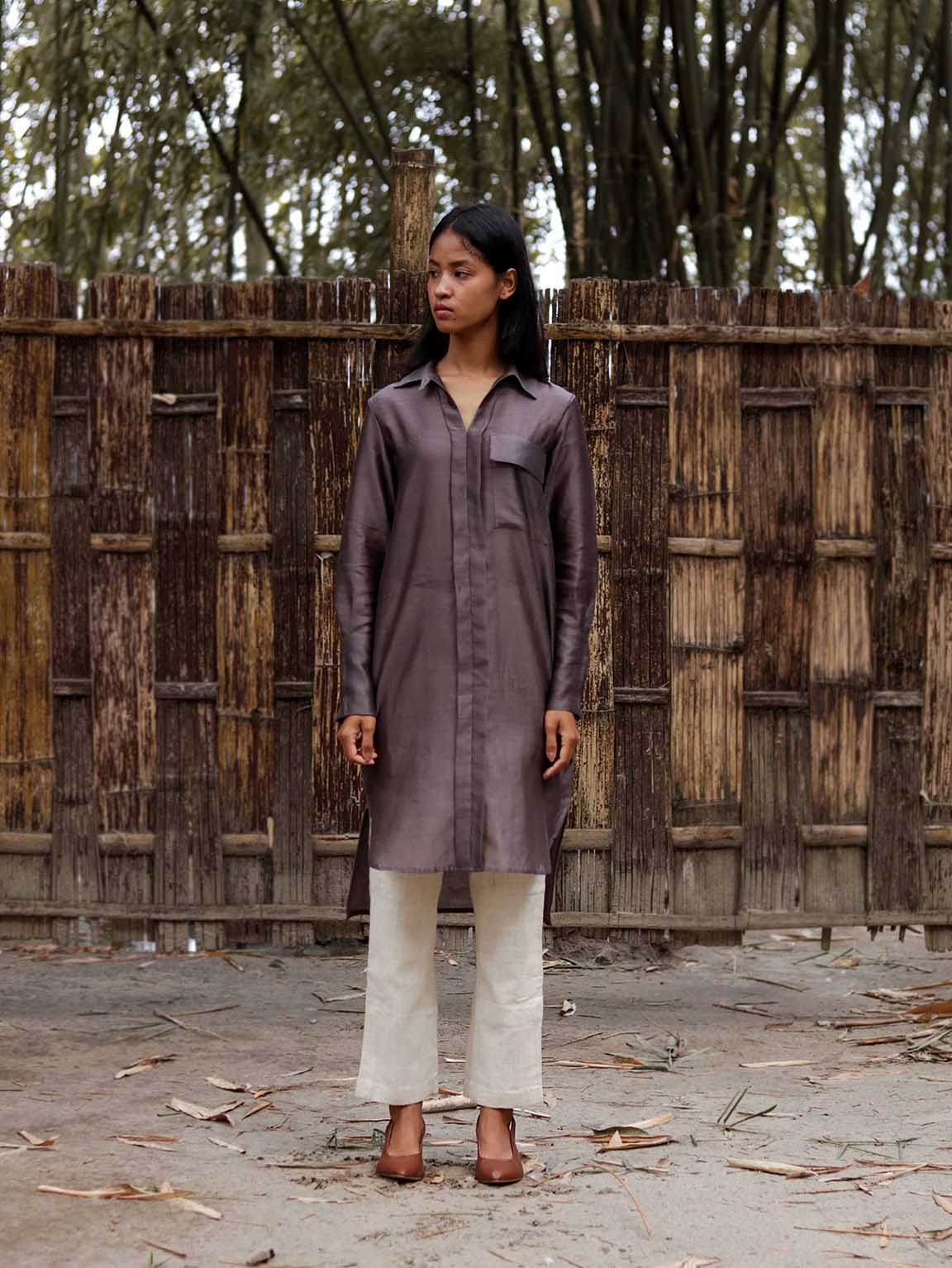 Long v neck slip-on grey-violet easy shirt with box pleat at back & asymmetrical hem, Relaxed Fit, Shell Buttons, Tea dyed Handwoven Chanderi Silk fabric. 