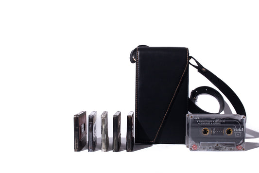 The record sling phone black made with conscious and vegan leather.