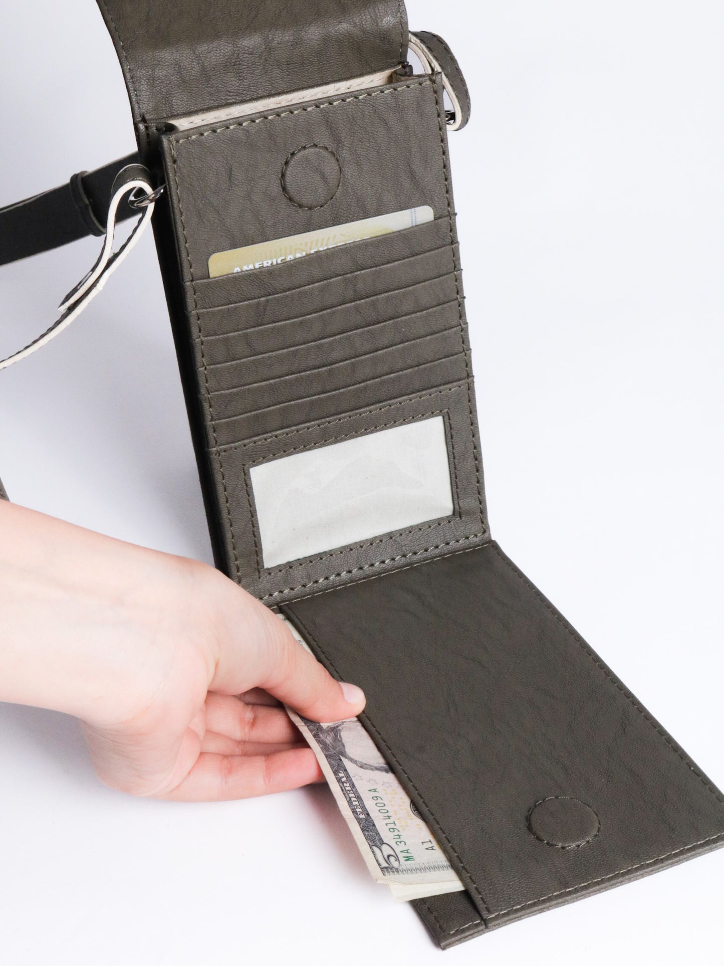 The record sling phone grey made with conscious and vegan leather.