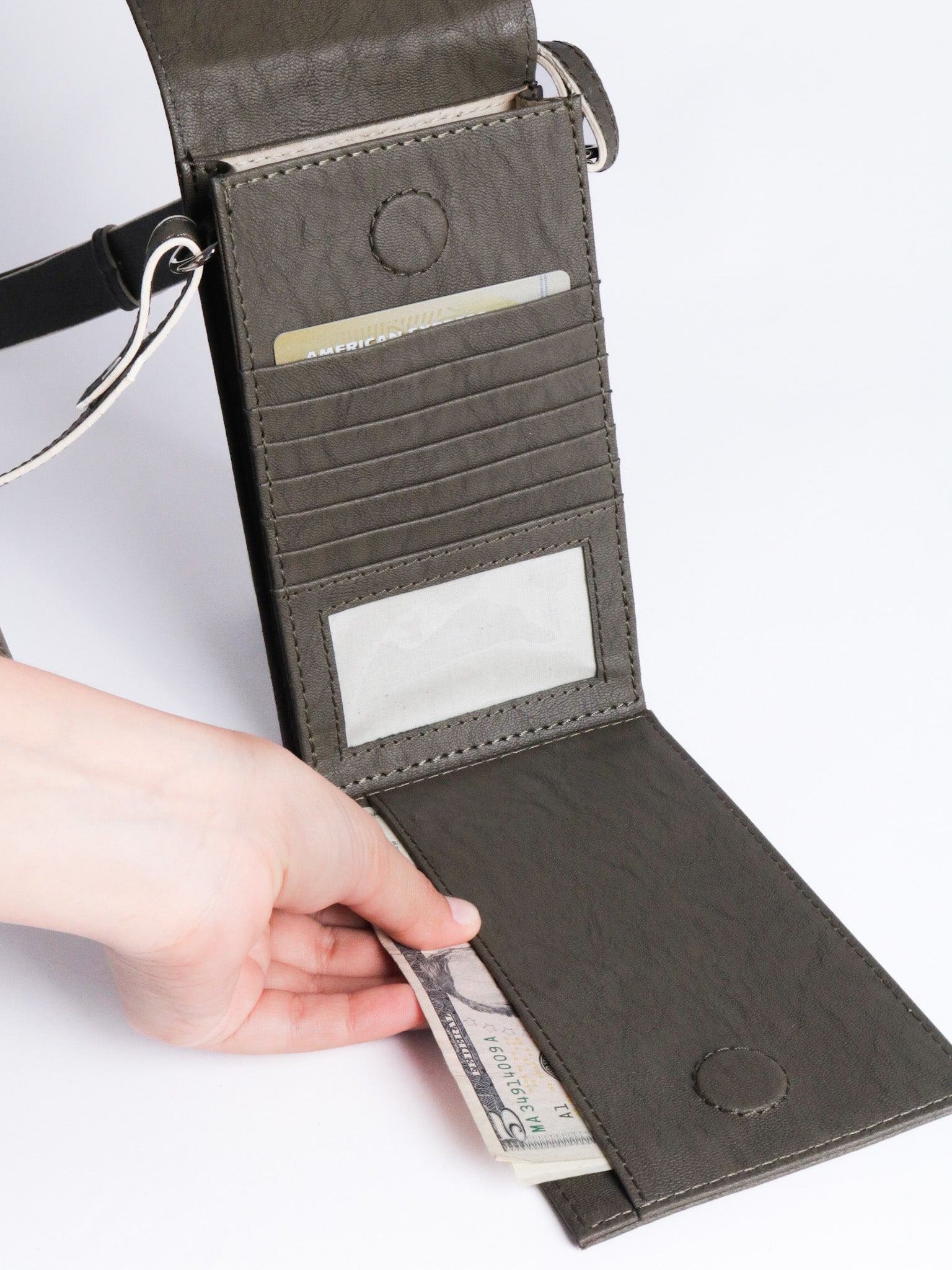 The record sling phone grey made with conscious and vegan leather.