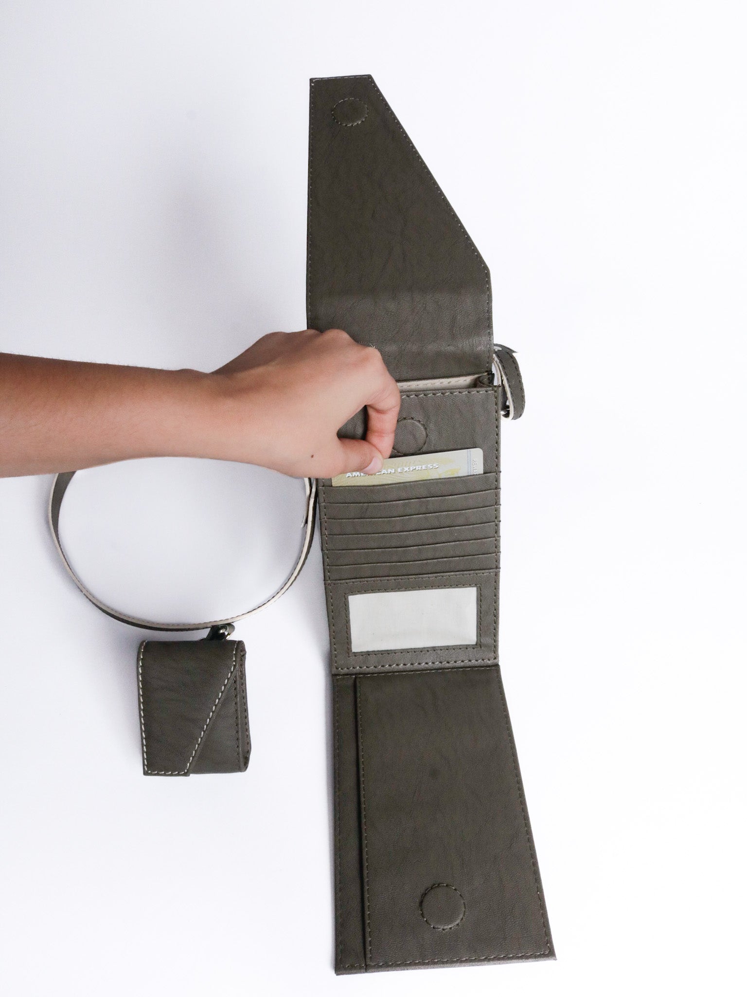The record sling phone grey made with conscious and vegan leather.