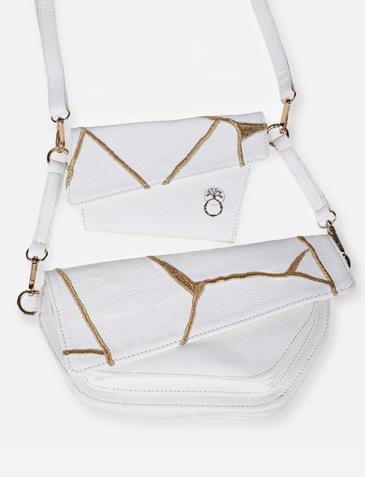 White/Ivory handcrafted adjustable upcycled leather sling bag with gold embroidery.