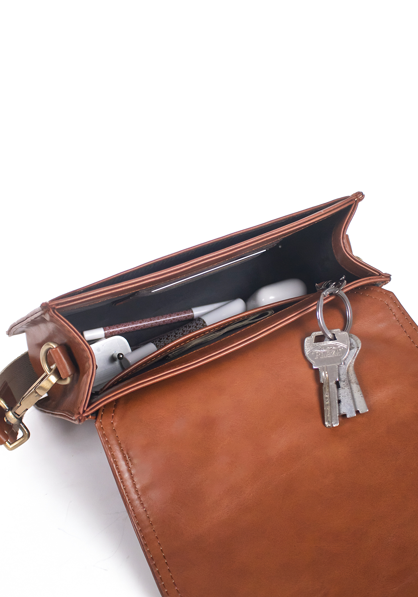 Tan/Brown sling bag adjustable made with conscious and vegan leather.